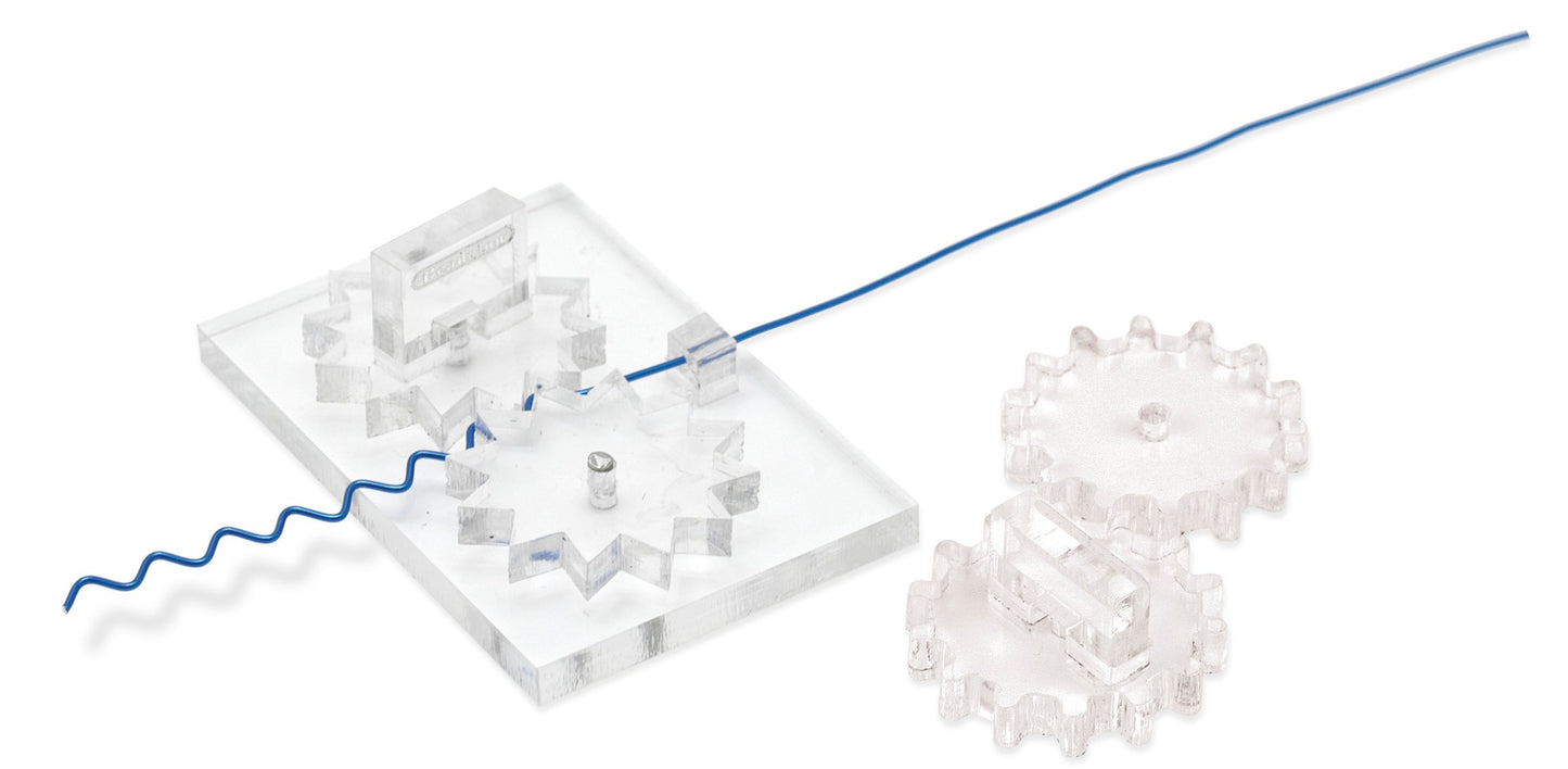 Close-up of a clear acrylic gear set with a blue wire demonstrating mechanics.