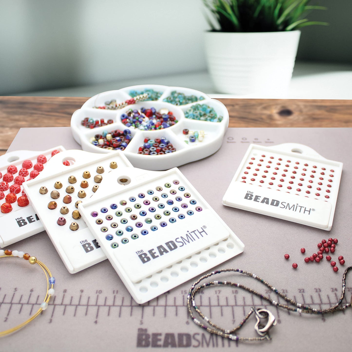 BeadSmith bead organizers with a variety of colorful beads and jewelry making supplies.